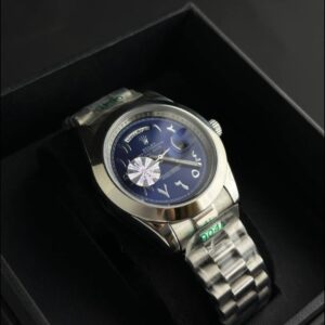 ساعة فاخرة بتصميم رولكس – مينا أزرق بأرقام عربية وسوار ستانلس ستيل (مناسبة للرجال والنساء)
